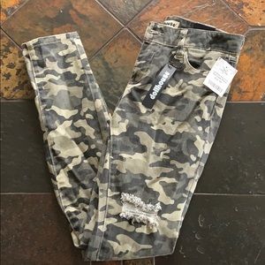 Distressed camo jeans